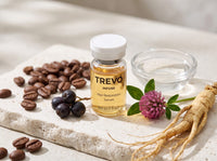 TREVO serum vial with coffee beans, saw palmetto berries, red clover and ginseng root